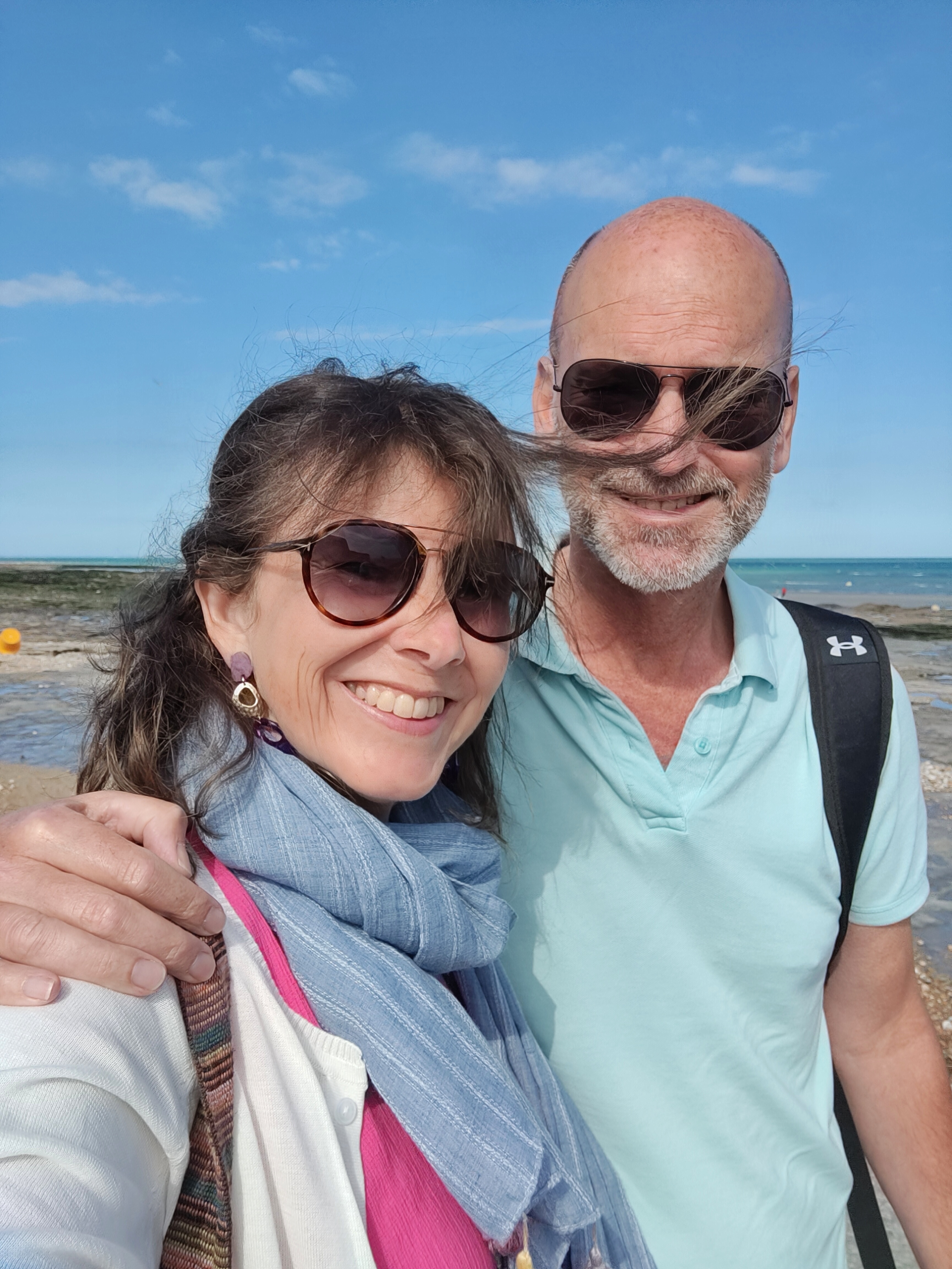seaside couple selfie both with sunglasses on